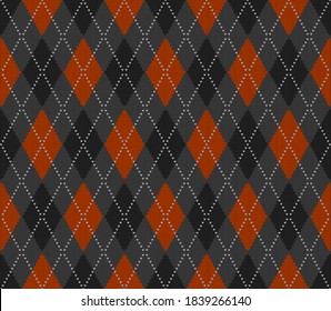 Knitted argyle Halloween pattern. Wool knitinng. Scottish plaid in orange, black and grey rhombuses. Traditional  Scottish background of diamonds . Seamless fabric texture. Vector illustration