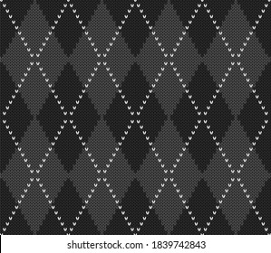 Knitted argyle Halloween pattern. Wool knitinng. Scottish plaid in gray and black rhombuses. Traditional  Scottish background of diamonds . Seamless fabric texture. Vector illustration