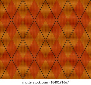 Knitted argyle Halloween pattern. Wool knitinng. Scottish plaid in orange and yellow rhombuses. Traditional  Scottish background of diamonds . Seamless fabric texture. Vector illustration