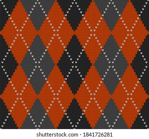 Knitted argyle Halloween pattern. Wool knitinng. Scottish plaid in orange, black and grey rhombuses. Traditional  Scottish background of diamonds . Seamless fabric texture. Vector illustration