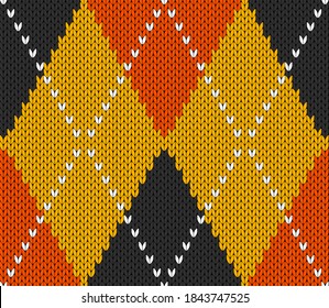 Knitted argyle Halloween pattern. Wool knitinng. Scottish plaid in orange, black and yellow rhombuses. Traditional  Scottish background of diamonds . Seamless fabric texture. Vector illustration