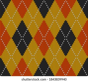 Knitted argyle Halloween pattern. Wool knitinng. Scottish plaid in orange, black and yellow rhombuses. Traditional  Scottish background of diamonds . Seamless fabric texture. Vector illustration