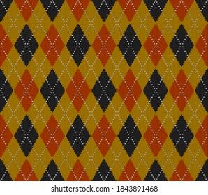 Knitted argyle Halloween pattern. Wool knitinng. Scottish plaid in orange, black and yellow rhombuses. Traditional  Scottish background of diamonds . Seamless fabric texture. Vector illustration