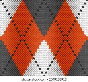 Knitted argyle Halloween pattern. Wool knitinng. Scottish plaid in orange, gray and white rhombuses. Traditional  Scottish background of diamonds . Seamless fabric texture. Vector illustration