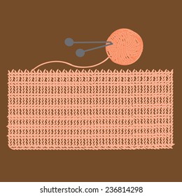 Knitted brown scarf and yarn ball