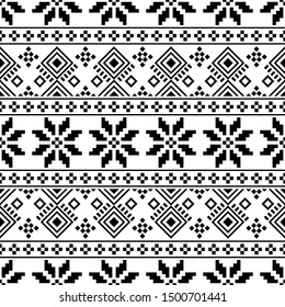 Knitted Christmas Ethnic pattern on white background. Ornament. Border. Seamless sample. It can be used as a background. Vector illustration.