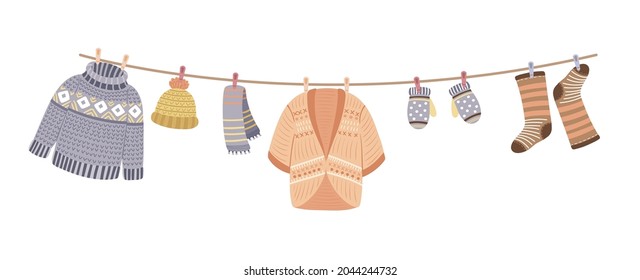 Knitted clothes on rope. Knit, wool thread cardigan and sweater. Knitting accessories, mittens and warm socks vector banner