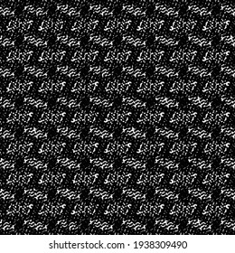 Knitted cotton fabric with a pattern of small patches. Textured background in black and white.