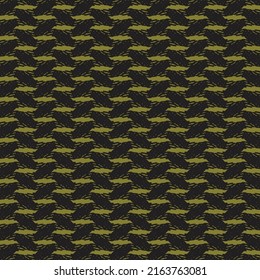 Knitted fabric with black and gold patches. Abstract tapestry texture.