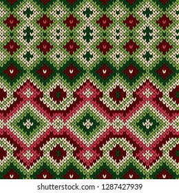 Knitted geometric decorative pattern in red, green and white hues, seamless vector as a fabric texture