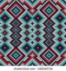 Knitted geometric ornamental pattern in the red, blue and white hues, seamless vector as a fabric texture