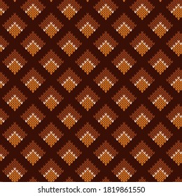 Knitted geometric seamless brown and orange pattern.Vector texture