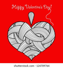 Knitted heart  with some thread . You can use it like greeting card for Valentine's Day.