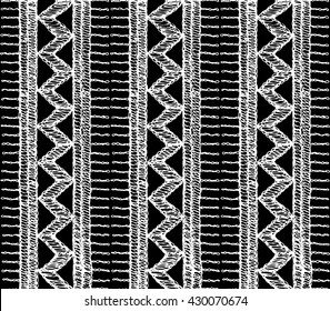 Knitted lace, lace pattern crochet, macrame. Floral seamless pattern with a fringe border knitted or woven macrame in boho style, chevron