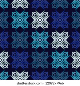 Knitted Norwegian snowflakes. Seamless vector background. Folk motives. Winter pattern. Can be used for wallpaper, textile, invitation card, wrapping, web page background.