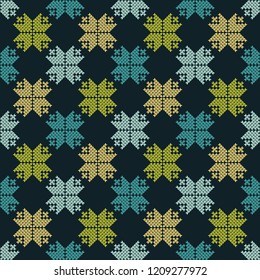 Knitted Norwegian snowflakes. Seamless vector background. Folk motives. Winter pattern. Can be used for wallpaper, textile, invitation card, wrapping, web page background.