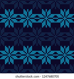 Knitted Norwegian snowflakes. Seamless vector background. Folk motives. Winter pattern. Can be used for wallpaper, textile, invitation card, wrapping, web page background.