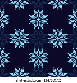 Knitted Norwegian snowflakes. Seamless vector background. Folk motives. Winter pattern. Can be used for wallpaper, textile, invitation card, wrapping, web page background.