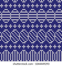 Knitted pattern of Easter eggs white on a blue background. Happy easter Greeting Card. Easter eggs on knitting pattern