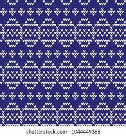 Knitted pattern of Easter eggs white on a blue background. Happy easter Greeting Card. Easter eggs on knitting pattern