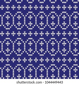 Knitted pattern of Easter eggs white on a blue background. Happy easter Greeting Card. Easter eggs on knitting pattern