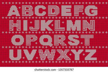 Knitted pattern of the English alphabet. White letters on a red background.