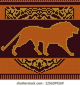 Knitted pattern of a lion's silhouette in the decorative frame.