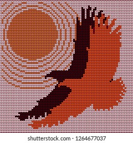 Knitted pattern of a pair of flying birds. Two eagles flying against the sun.