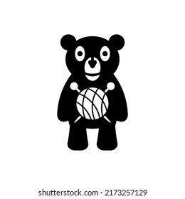 Knitted plush toy with cartoon bear illustration, knitting needles and ball of thread. Isolated vector drawing on white background.