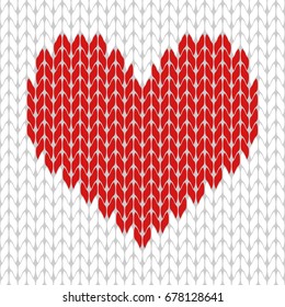 Knitted red heart on the white background pattern isolated vector