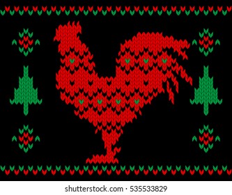 Knitted Red Rooster on the black background. Symbol of the New Year 2017. 
