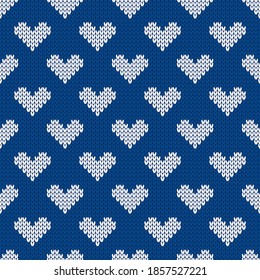 Knitted seamless cozy pattern with hearts. Nordic style sweater. Vector illustration for Valentines Day. Traditional holiday background.
