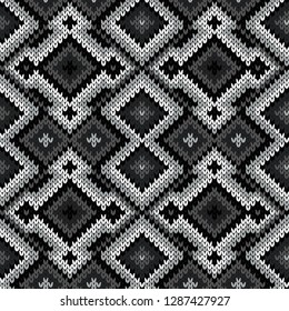 Knitted seamless ornate pattern with interlacing lines in monochrome hues vector as a fabric texture