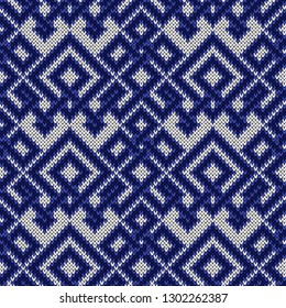 Knitted seamless ornate pattern with interlacing lines in blue hues on the white background, vector as a fabric texture
