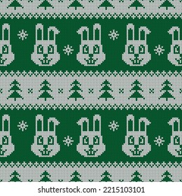 Knitted seamless pattern for 2023 New Year of the Rabbit. Vector ornament with cute bunnies, snowflakes, and Christmas trees. Green and white sweater print.