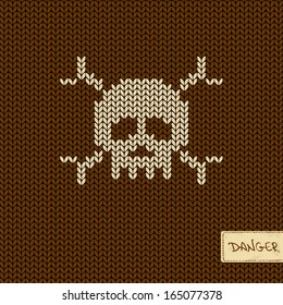 Knitted seamless pattern or background with skull and crossbones