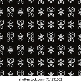 Knitted seamless pattern butterflies and flowers