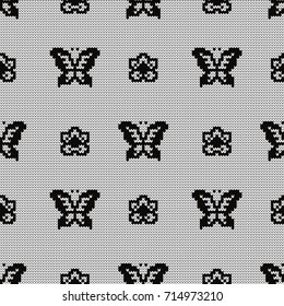 Knitted seamless pattern butterflies and flowers