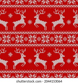 Knitted seamless pattern with deers, and traditional scandinavian ornament. Red and white sweater background for Christmas, New Year or winter design. Vector illustration.