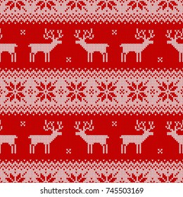 Knitted seamless pattern with deers and traditional scandinavian ornament. Red and white sweater background for christmas or winter design. Vector illustration.