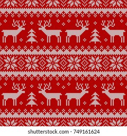 Knitted seamless pattern with deers and traditional scandinavian ornament. Red and white sweater background for christmas or winter design. Vector illustration.