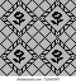 Knitted seamless pattern flowers in rhombuses