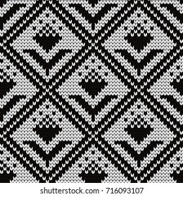 Knitted seamless pattern flowers in rhombuses