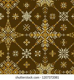 Knitted seamless pattern with geometric snowflakes.Vector texture