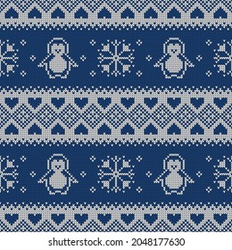 Knitted seamless pattern with penguins, snowflakes, and hearts. Winter sweater background. Vector illustration.