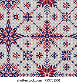 Knitted seamless pattern of red-blue snowflakes on a white background.Vector