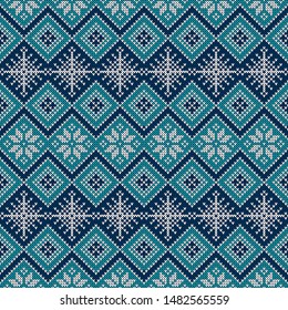 Knitted seamless pattern with snowflakes and traditional scandinavian ornament. Blue and white sweater background for Christmas, New Year or winter design. Vector illustration.