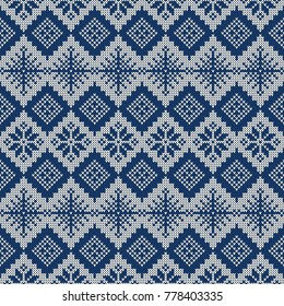 Knitted seamless pattern with snowflakes and traditional scandinavian ornament. Blue and white sweater background for Christmas, New Year or winter design. Vector illustration.