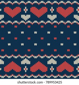 knitted seamless vector pattern with hearts  on a dark blue background