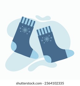 Knitted Socks. Winter and autumn accessories for a cozy evening. Wool blue socks with snowflake. Vector flat illustration.